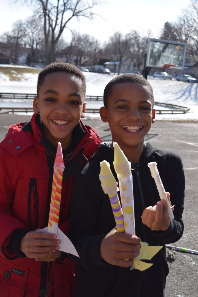 Explor boys rockets ExplorSchool students with rockets outside